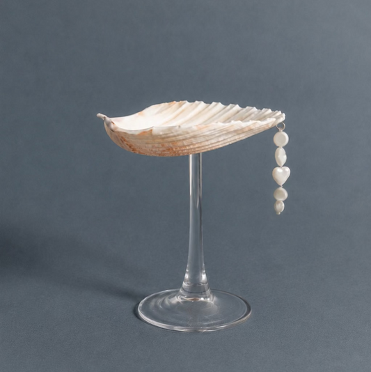 Scallop shell coupe on glass stem with pearl bead charm, full view
